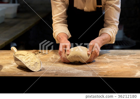 baker making bread dough at bakery kitchen 36212180