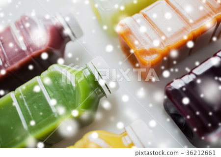 bottles with different fruit or vegetable juices bottles with different fruit or vegetable juices 36212661