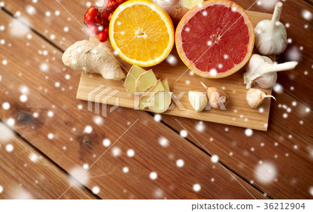 citrus, ginger, garlic and rowanberry on wood 36212904