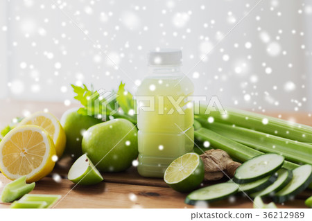 bottle with green juice, fruits and vegetables 36212989