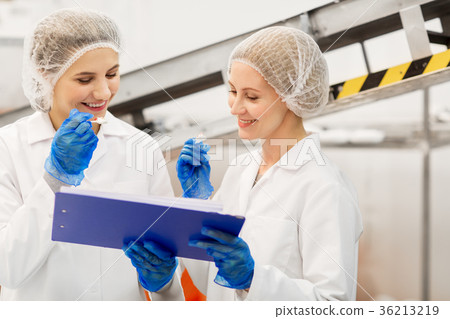women technologists tasting ice cream at factory 36213219