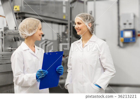 happy women technologists at ice cream factory 36213221