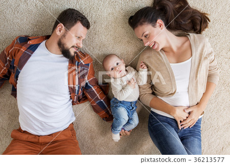 happy family with baby lying on floor at home happy family with baby lying on floor at home 36213577