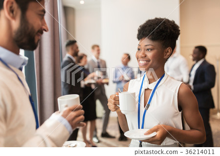 business people with conference badges and coffee 36214011