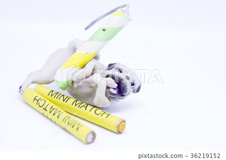 Dog with mini match firecracker to set on fire. 36219152