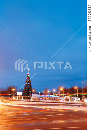 Christmas tree on a background of blue evening sky Christmas tree on a background of blue evening sky 36220312