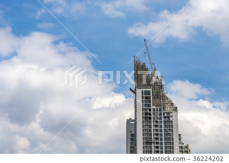 Crane working on high building 36224202