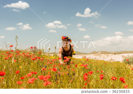 Teen girl in poppy field outdoor Teen girl in poppy field outdoor 36230835