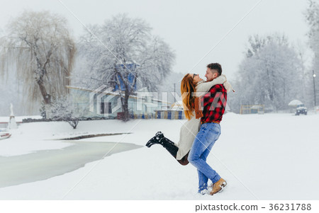 Happy loving couple is having fun in the winter 36231788