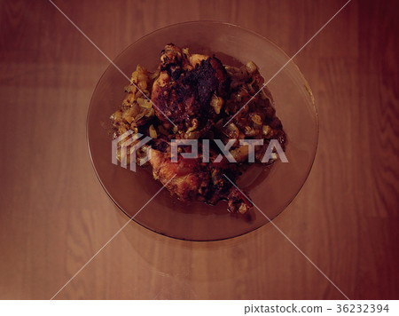 Pieces of fried chicken with fried onions. 36232394