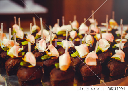 buffet lunch dark bread with bacon and salted  36233094