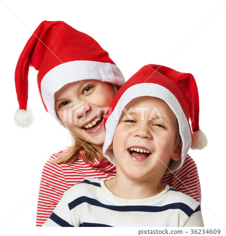 Girl and little boy in Santa Claus hat 36234609