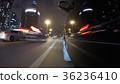 Fast city drive night road POV through city at 36236410