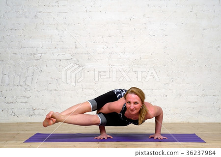 Adult woman practicing yoga Adult woman practicing yoga 36237984