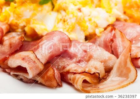 Closeup of scrambled eggs with bacon 36238397