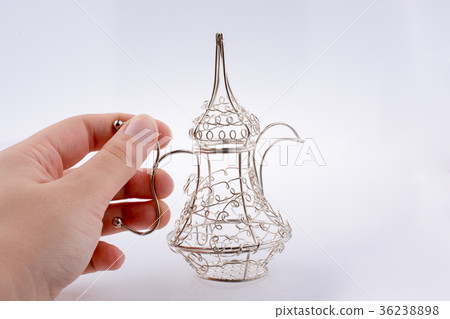 Silver color metal jug in hand Silver color metal jug in hand 36238898