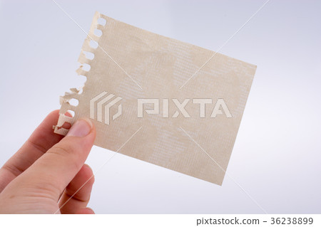 Hand holding a note paper Hand holding a note paper 36238899