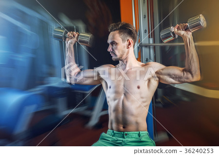Handsome caucasian man working out at gym and Handsome caucasian man working out at gym and 36240253