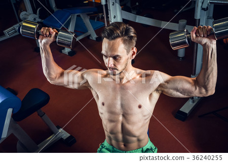 Handsome caucasian man working out at gym and Handsome caucasian man working out at gym and 36240255