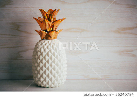 Decorative ceramic pineapple on white background Decorative ceramic pineapple on white background 36240784
