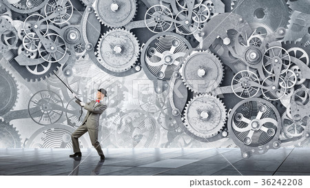 图库照片: man make gears mechanism work