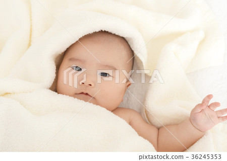 Baby wrapped in a towel 36245353