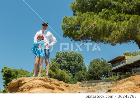 Tourists father and daughter on Aegean coast of Tourists father and daughter on Aegean coast of 36245765