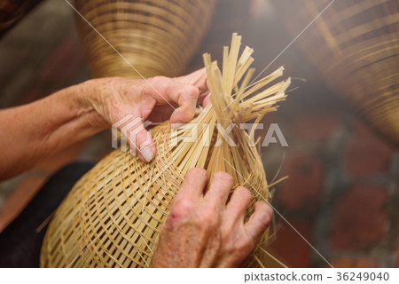 Vietnamese fishermen are doing basketry  36249040