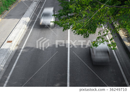 Motion blur of cars over the road 36249710
