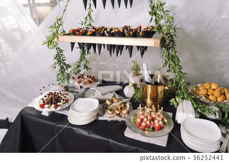 Catering, a wedding table with champagne, fruits Catering, a wedding table with champagne, fruits 36252441