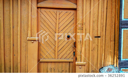 Background fence in summer with door, in autumn 36252891