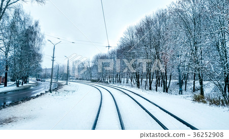 White snow in city on a tramway in November, first 36252908