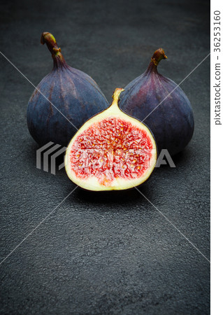 Fig isolated on dark concrete background Fig isolated on dark concrete background 36253160