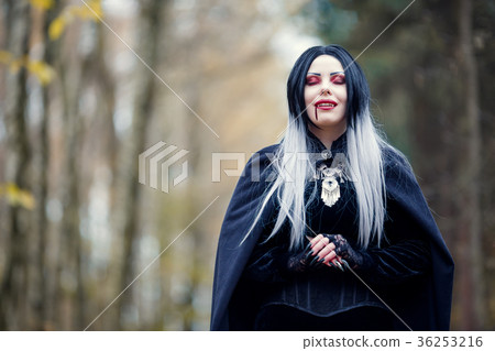 Portrait of vampire girl with eyes closed with 36253216
