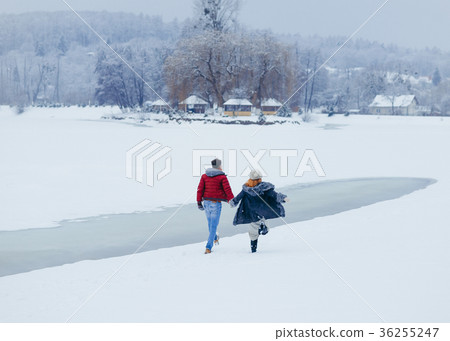 The walk of the happy loving couple holding hands The walk of the happy loving couple holding hands 36255247