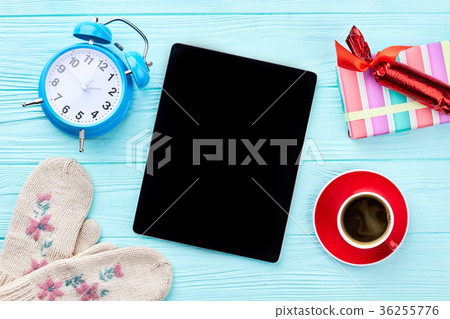 Computer tablet and New Year decorations. Computer tablet and New Year decorations. 36255776