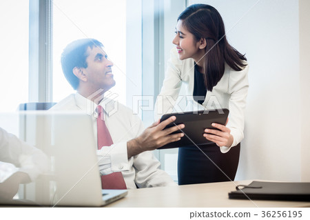 Businessman and secretary checking days schedule 36256195