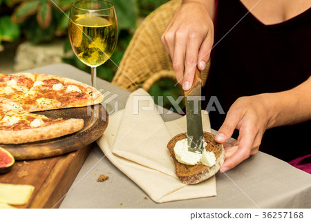 Female hands make sandwich of rye bread and cheese Female hands make sandwich of rye bread and cheese 36257168