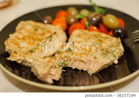 Roasted salmon steak with vegetables on plate 36257194