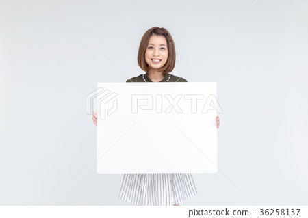 A woman with a white board A woman with a white board 36258137