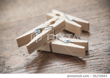 wooden clothes pin on wooden table background wooden clothes pin on wooden table background 36258665