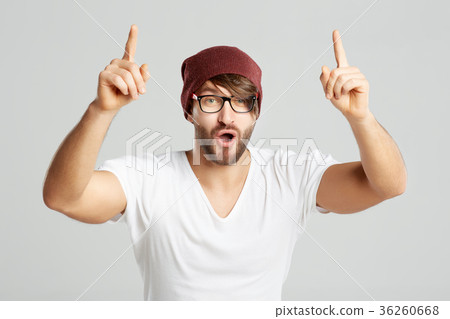 Handsome young man posing at studio 36260668