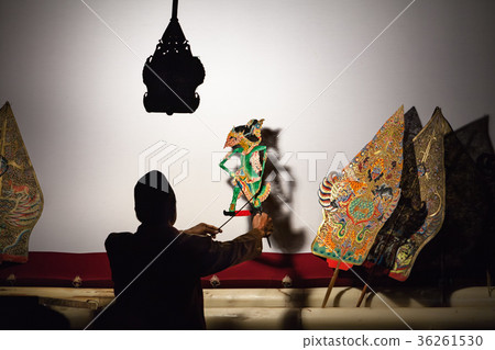 Silhouette of puppeteer with old shadow puppets Silhouette of puppeteer with old shadow puppets 36261530