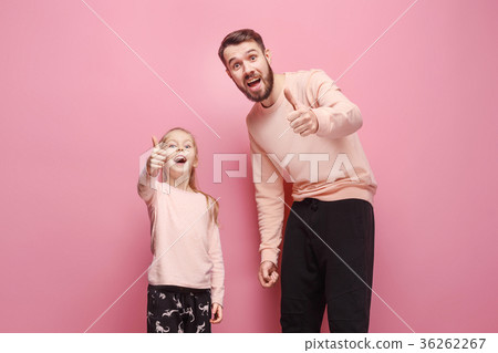 Young father with his baby daughter with thumb up Young father with his baby daughter with thumb up 36262267