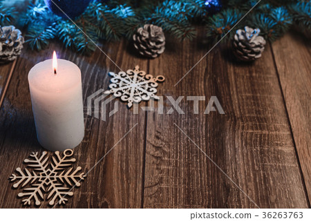 christmas candle on a wooden background christmas candle on a wooden background 36263763