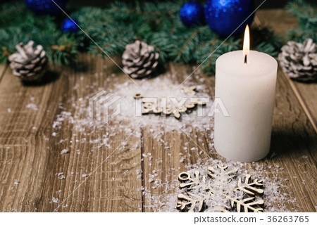 christmas candle on a wooden background christmas candle on a wooden background 36263765
