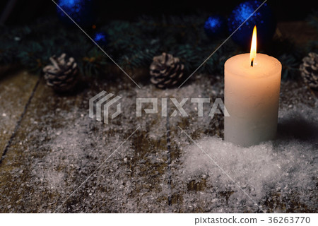christmas candle on a wooden background 36263770