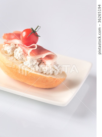 Toast with robiola and prosciutto Toast with robiola and prosciutto 36265194