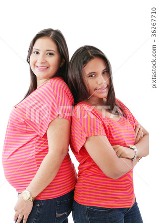 hispanic pregnant woman with her daughter 36267710