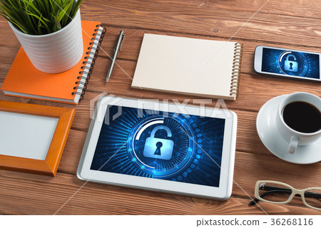 Web security and technology concept with tablet pc on wooden table 36268116